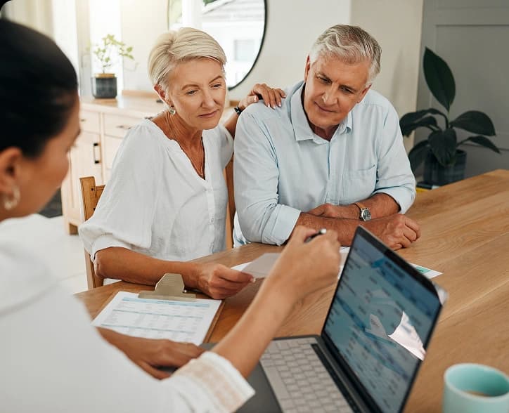 Senior couple consulting with financial advisor